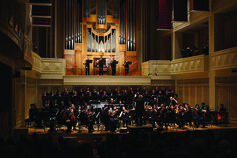 An orchestra performAn orchestra performing on stageing on stage.